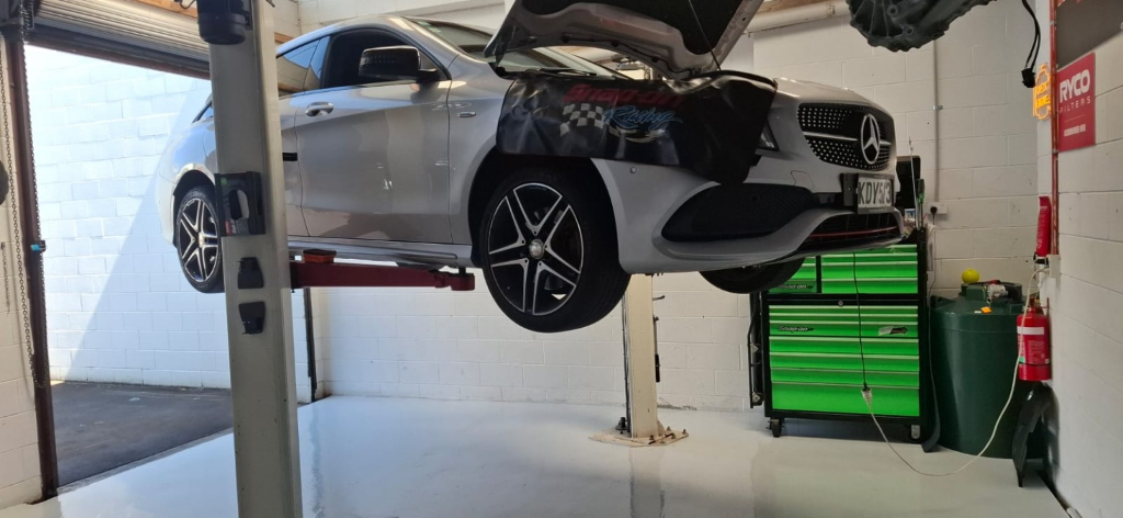 Mercedes on lift in workshop